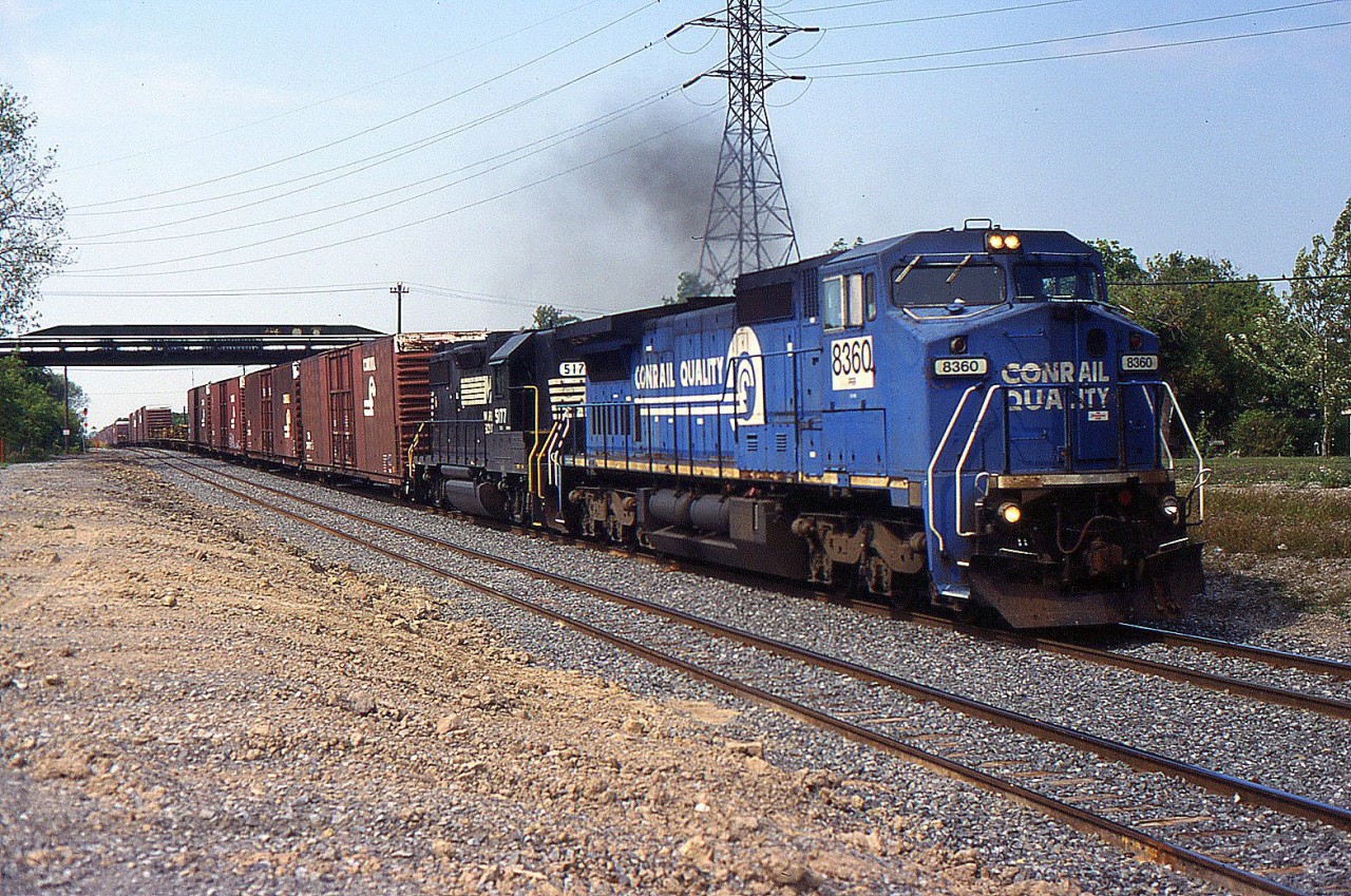 NS 328 with Ex CR C40-8W 8360 and NS GP38-2 5177 through Merritton in 2001.