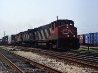 A pair of old CN M-420(w)s and CN GP9RM lead 449 through Merritton on a hot summer day in June 1996.