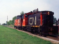 549 with CN SW1200RS 1389 and CN Van heading northbound on the CN Fonthill Spur just crossed over Hwy 58 in the background.