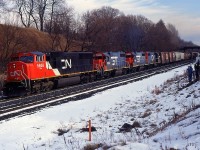 A CN Westbound with CN SD70I 5608, GTW GP38-2 4908, GTW GP38-2 4904, and CV GP38-2 5801 climb the grade up at Copetown at Inksetter Rd.
