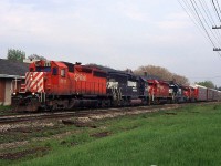 NS 327 with CP SD40-2 5521, NS GP60 7143, CP SD40-2 5543, NS SD40-2 6145, and STLH SD40-2 5615 through St. Catharines, ON