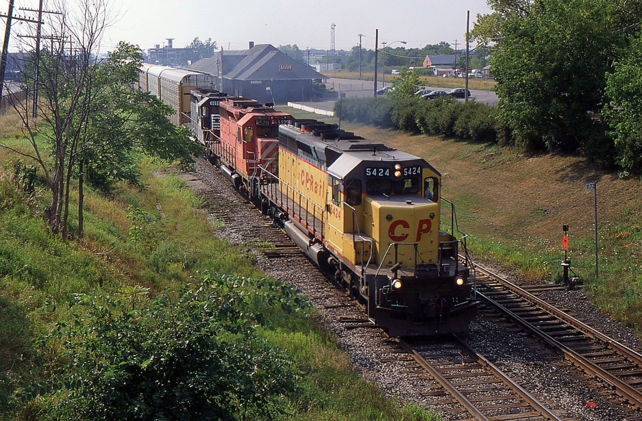 NS 287 with CP SD40-2 5424, CP SD40-2 5529, and NS SD40-2 6098 passed through St. Catharines in 1998.