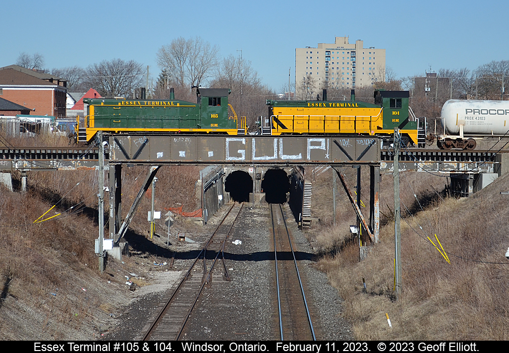 In what is a classic Windsor shot, Essex Terminal units #105 & #104 roll over the cut of the former Canada Southern, now Canadian Pacific, that leads to the Windsor/Detroit Railway tunnel.  Sadly no train was coming out of the tunnel today to get the over/under but this location still makes for a great shot.  Too bad the 'Taggers' couldn't leave the bridge alone though.....