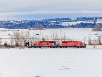 Decades later, and still earning their keep. A pair of London built GMD SD40-2's take charge on this southbound CWR train across the MacTier bound for Toronto.