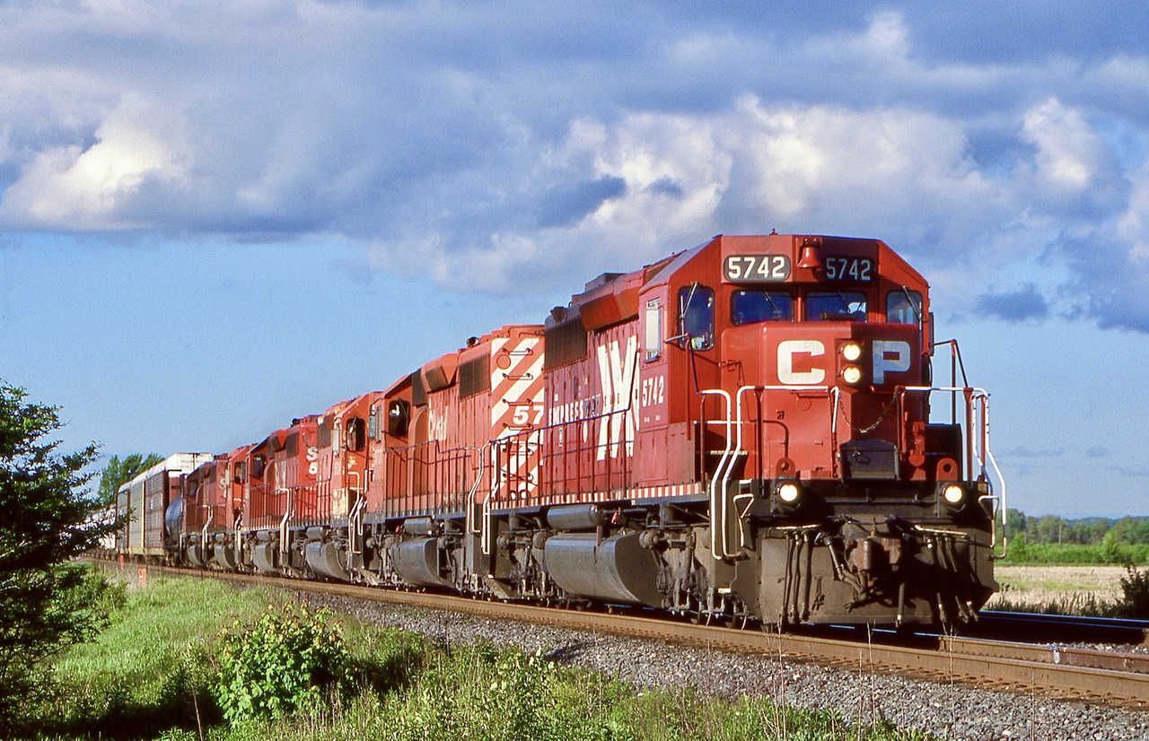 CP 5742 and I believe 5745 were the only two units painted up for CP’s new “Expressway “ service, they were not dedicated strictly to that service and soon new SD40’s especially the “red barns” bumped them from that service. Here a very clean looking 5742 leads a six pack of SD40-2’s including a pair of St. L&H painted units. The train is departing the dip at Hornby with a mixed train under some nice late afternoon lighting.