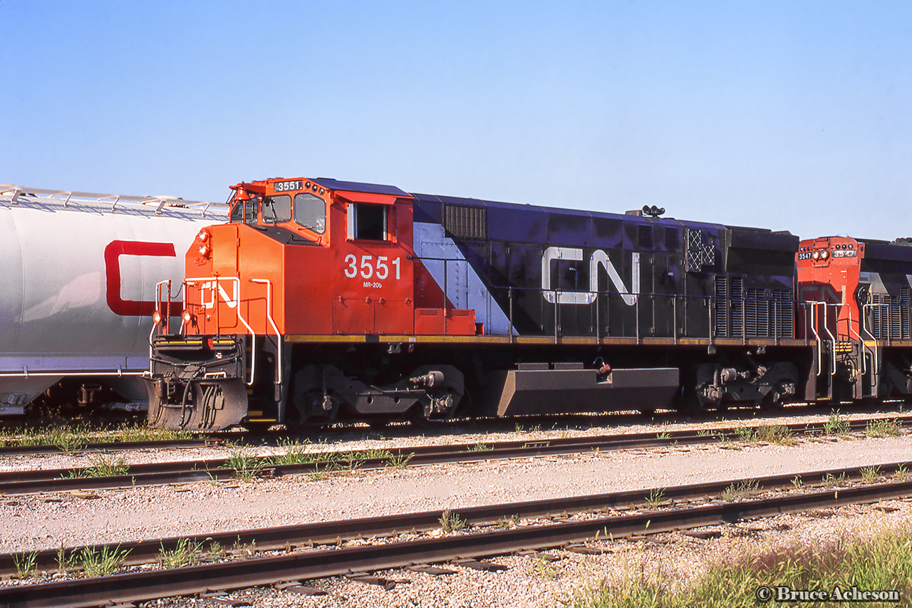 A pair of MLW M420s are seen in the yard at Jarvis.  3551 had been repainted into this scheme in 1994.