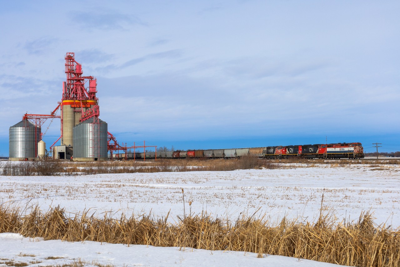 A 41851 15 rolls past the Westmor Grain Elevator in Morinville, Alberta with BCOL 4609, CN 5750, CN 9531 and CN 9579