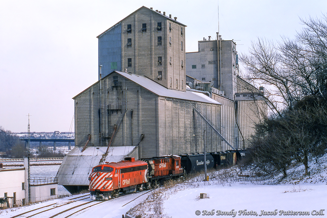 "It'll cut through snow as high as the headlight!"  The CP Goderich wayfreight, ordered at Hamilton Chatham Street, generally saw various models of GMD and MLW road switchers assigned as power over the years, but during the harsh winter months an F-unit often made an appearance.  Longtime wayfeight engineer Donald Broadbear regularly requested this power to cut through the heavy lake effect snowdrifts of Perth and Huron Counties.  Here, the wayfreight switches cars at the Goderich Elevators before returning home to Hamilton.  Note the Maitland River trestle in the distance, which the train will cross upon departing the yard.Well known in railway circles for his knowledge of steam locomotives, Don Broadbear passed away earlier this week on February 21, 2023, weeks after his 92nd birthday.  He and his father, Percy, owned the Pinafore Park Railway in St. Thomas where many got their start in railway preservation.  Don was also a founder of the Port Stanley Terminal Railway, the Ontario Southland Railway, took on the task of restoring and operating Essex Terminal 0-6-0 number 9 as part of the Southern Ontario Locomotive Restoration Society (SOLRS/St. Thomas Central Railway), and later at the Waterloo Central Railway.  Don's obituary can be found here.Rob Bondy Photo, Jacob Patterson Collection.