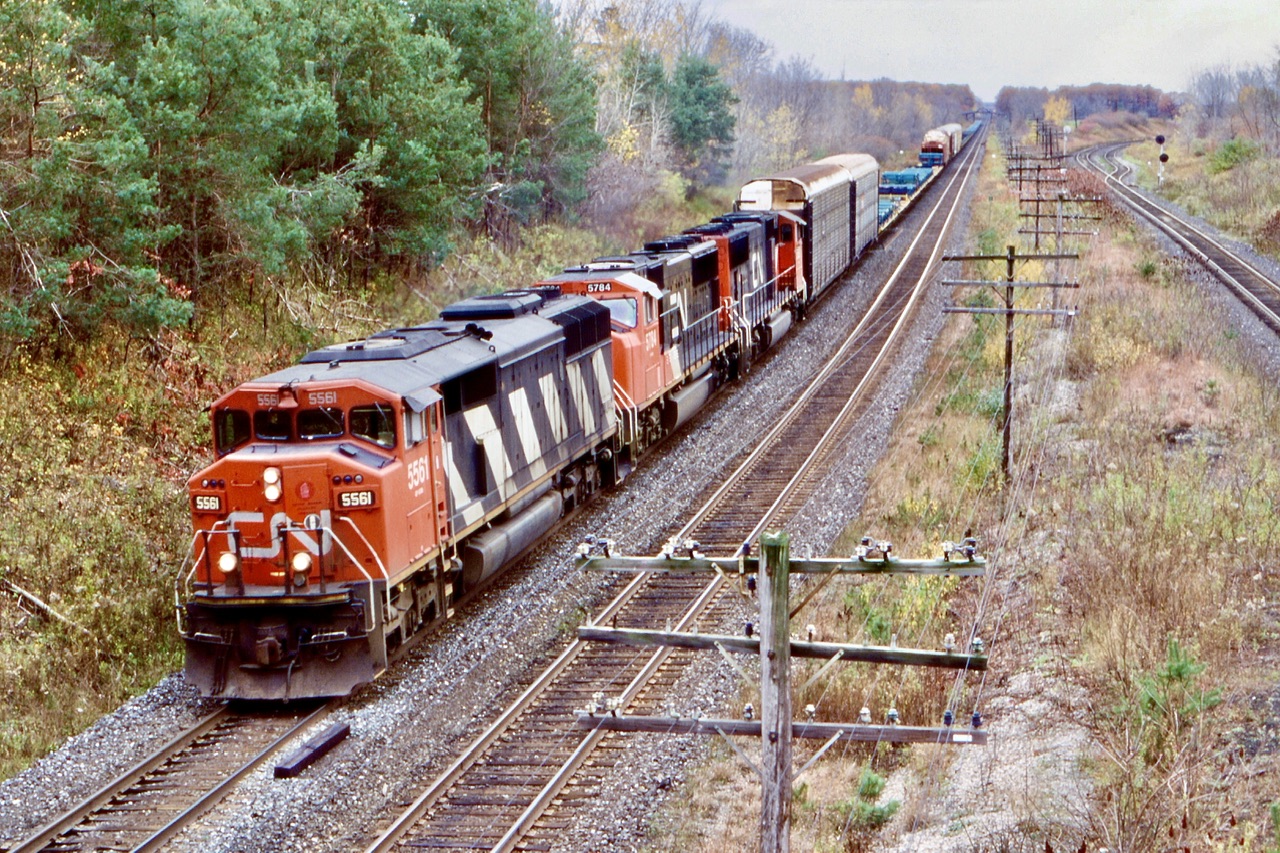 Another spot I haven't spent enough time at over the years. The  long wooden bridge here has long be a favourite railfan spot west of London. I would imagine the trees here have filled in a fair bit in the twenty years that have passed. Always enjoyed a day spent here. In this photo I have a train listed as CN 380, but looks a lot like 434 with SD60 5561 in the lead. The CP Windsor sub. Can be seen to the right with Lobo siding starting in the distance.