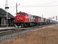 Spiffy assortment of power on this eastbound as it rolls by the old Burlington West station, once known as the Freeman station. In consist is CN 2575, 2100, 2309 and 9468. Models MLW M-420, BBD HR616, MLW M-636 and the once common GMD GP40-2L.  (The 9468 is now on the roster of DMVW).
My assumption that this is 434 is based on the fact very few freights other than 434/435 operated east of Burlington on the Oakville sub. Nice clean paint job on the leader!