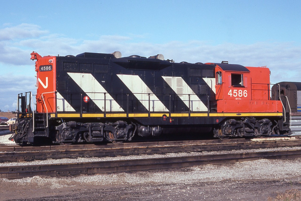 Mac Yard.  I always considered this to be in the community of Concord. Now I wonder if Concord even exists any more. Early in this railroad photography hobby my favourite locomotive was the GP9. I liked its clean lines, and how reliable they seemed to be. Made for great lashups out of Fort Erie, where a good number of them were based. This "roster" shot of CN 4586 worked out just right for me on a visit to Mac Yards many years ago, and although it isn't in the solid black scheme I liked, it is still a great example of what used to be.  The CN 4586 was rebuilt into 7218 back around 1993, and it eventually was retired in 2011. Sad that GP9s as I knew them are now gone. There used to be hundreds of them on the CN in the '70s.