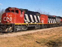 The grain extra has some additional help on this sunny day with the beetle 9105 spliced between the 5607 and 5580. Amazing weather for the time of year, the winter of 87/88 had little snow. I can remember seeing people out on the golf course during Christmas week. This photo taken at mile 25.5, time approx. 15:30.