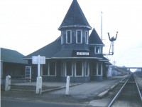 Yes; this early April day back in 1974 was as gloomy this scene appears. But I rather like the mood of it.
The image is of the Grimsby CN station, looking west. The structure burned own on the last day of 1994, after several years serving commercial purposes. Electrical fire.  The building on the extreme left is the GWR (Great Western) station, built 1855; and has been thru several changes over the many years of its existence.  Currently, it stands vacant. Renovated inside and out, it was to become an eatery/pool hall but financial difficulties have put the project on hold this last 3 years.