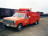During my tenure as CN's Regional Supervisor Work Equipment Operations in the mid-1980's, I was able to renew the fleet of Work Equipment Field Maintainer vehicles with new, purpose-built service trucks. CN N175464, a 1985 Ford F-350 XLT had only been in service a few short months when I snapped this photo. These well equipped (at the time) vehicles had an air compressor, diesel fired welding machine, oxy-acetylene equipment, tool chest storage compartment, component bins and racks, and plenty of space for spare and repair parts. They certainly stood out amongst the crowd in their bright CN Orange No. 12 Work Equipment paint. Behind the truck is a plethora of vintage CN rolling stock from the era. 40' box cars in Work Equipment tool car service, a wood sheathed box car converted to a generator car, a Work Equipment machinery flat, an insulated and heated water transport tank car, a transfer van, and a Transportation Department 'Blue Fleet' accommodation unit. Oh, the good old days! :-)