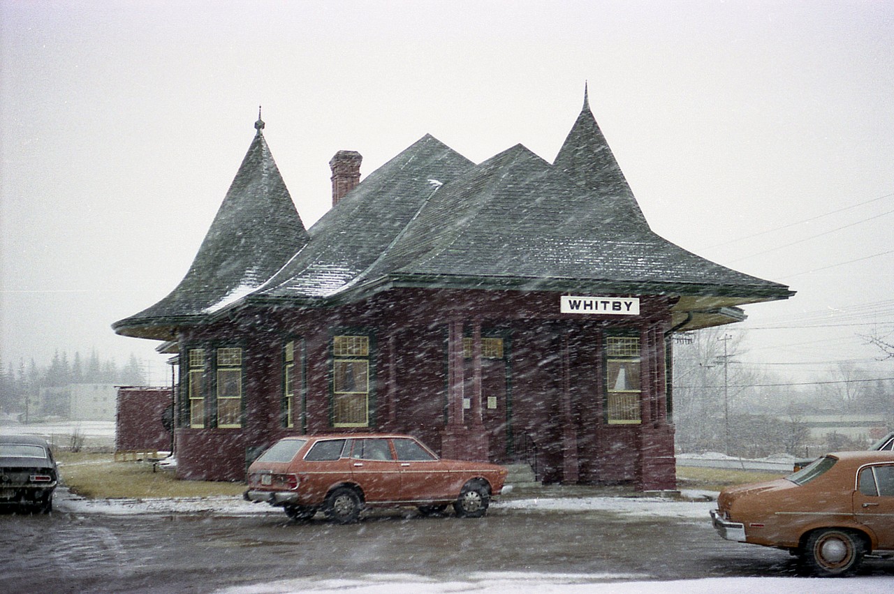 The old Whitby Junction station was built in 1903 at the foot of Byron St in town, roughly where the current GO platform is located.  Station closed in 1969 and fortunately was moved in 1970 to Victoria & Henry Streets, as pictured here. Later it was moved across the street to Iroquois Park. It has been expanded and upgraded; restored inside to perfection, one might say, as the Station (Art) Gallery. It is fitting that a structure as beautiful as this was saved. The image reminds me of the days when I would go anywhere in any weather to shoot a station photo........even over to the east side of (ugh) Toronto !!