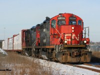 CN L542 with 7038 and 7081 are approaching Eagle Street North in Cambridge on the Galt Industrial Spur with cars for Gillies Lumber and Hunts Logistics. January 4, 2022.
