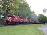 For a long time this was a favourite place to wait for CP heading toward Hamilton.  The South Siding Switch Montrose. Unfortunately the track is gone save for a switchback to industries for the Welland local. Adding to the situation is Niagara's endless determination to obliterate on street parking (how dare anyone park for free!) with No Parking signs, fences and what-have-you to discourage motorists stopping here. Not that it matters here any more. The tower in the background has been so ambushed by new highrise hotels I am not sure if it is even visible from this angle any more.
More good old days gone by.  Power on this train is CP 3030, 4233, 4218 and 8235; accelerating now that it has escaped the slow order confines of the Clifton Hill tourist area a mile or so back.