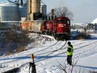 An Extra CP Wolverton Job with 3134, 3117 and 3045 are switching the Growmark (FS Partners) facility track in Ayr, Ontario on the Ayr Pit Spur during a winter afternoon. This track once again started seeing service the year prior.