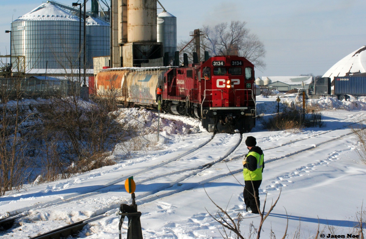 An Extra CP Wolverton Job with 3134, 3117 and 3045 are switching the Growmark (FS Partners) facility track in Ayr, Ontario on the Ayr Pit Spur during a winter afternoon. This track once again started seeing service the year prior.