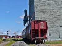 Grain hoppers waiting to load at the former Alberta Wheat Pool elevator in Camrose, Alberta.