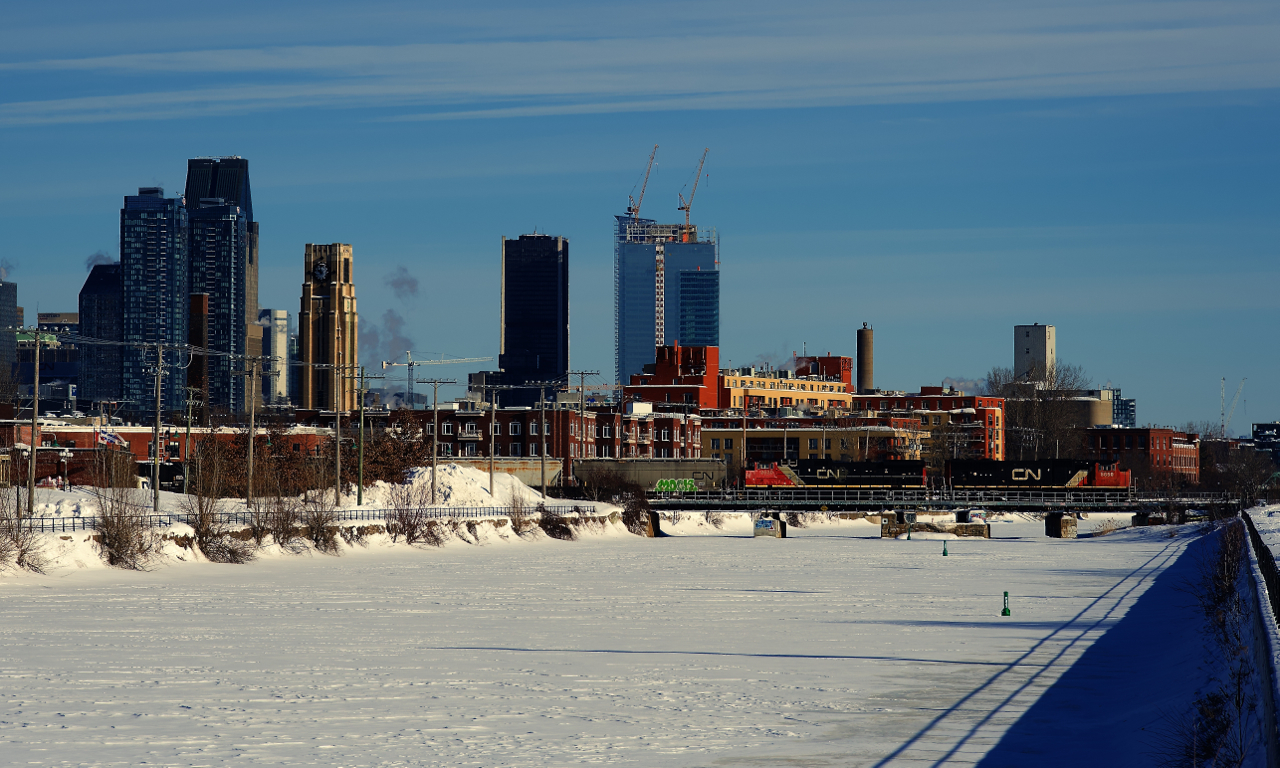 CN 5650 & CN 2520 are leading a late CN 430 over the snow-covered Lachine Canal on a very cold morning. The power had come to Montreal on grain train CN 846 from Michigan.
