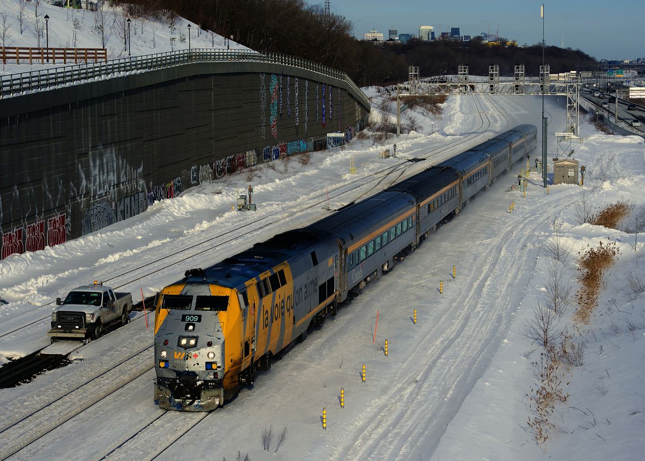 On the coldest day of winter so far, VIA 35 is about two hours late as it passes a foreman at Turcot Ouest.