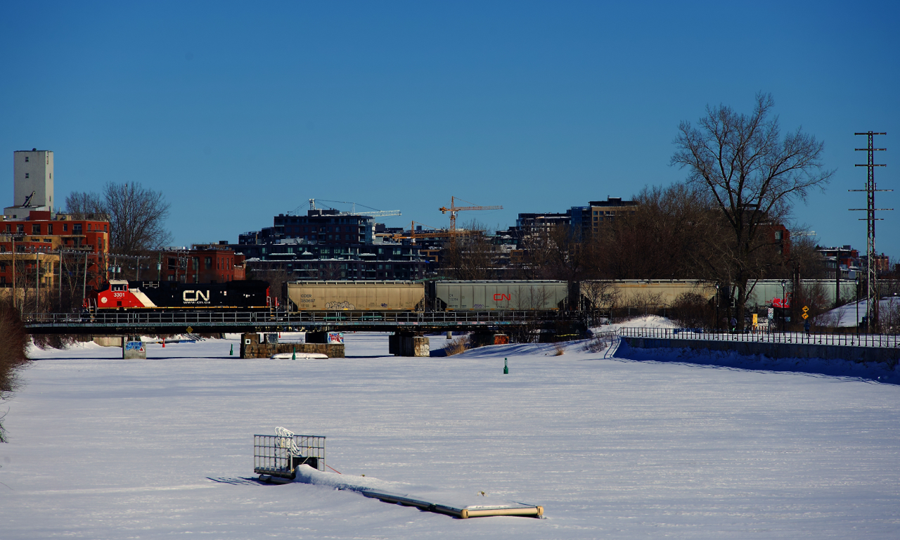Rebuilt CN 3301 brings up the rear end of grain train CN 878, on its way the Port of Montreal.