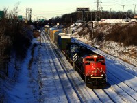 CN 322 is passing Ballantyne with CN 8005 & BCOL 4653 up front and CN 8951 mid-train. Soon it will stop at Turcot Ouest to set off cars.
