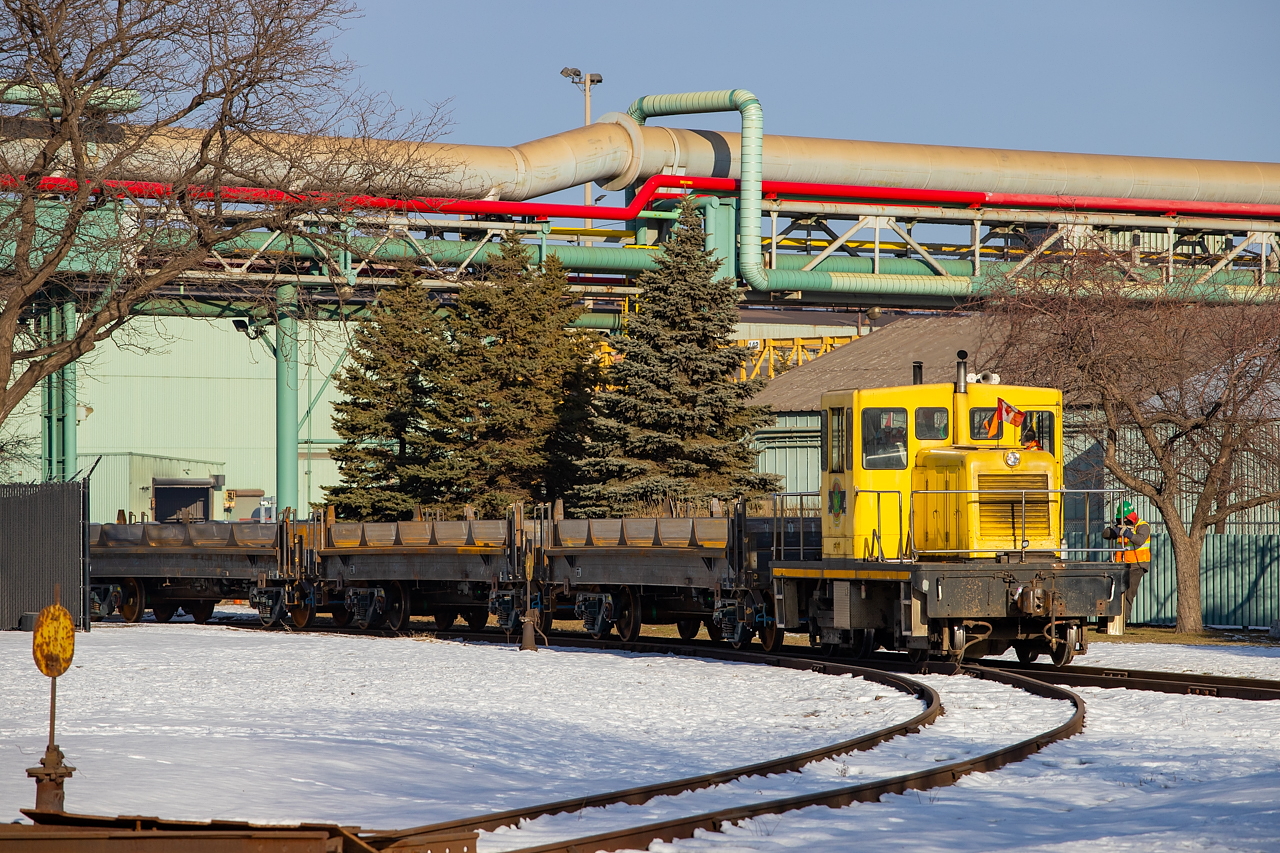 Since the NS coils currently being built are one of the key points of interest in southern Ontario railfanning of late, figured I'd get in on the fun. Here we see the NSC critter out and about, making a move among their storage cars over on the Coke Oven Leads out front of Dofasco. Currently among those cars are both painted and unpainted NS/NKLX coils (as Trenergy in St. Catharines isn't building hoods as quickly as NSC is building cars), with unpainted pictured here. They ended up pulling a tagged NSCX demo car out of the storage pile - for what reason, I have no idea.
