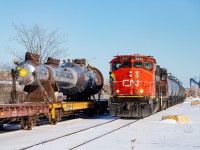 The CN 0700 Yard Job is shoving towards Parkland Fuels as they pass by an impressive dimensional load from Hooper Welding. This is the second such load I have seen in the last two months, with the other <a href="http://www.railpictures.ca/?attachment_id=50944">here</a>. Even the crew members seemed impressed by this one.
