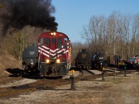 On a gorgeous April morning, (at the time) recently re-activated RS23 503 is back doing her thing, as they drill cars in Tillsonburg after making the trip down from Salford earlier. The hogger gives a nice touch of the throttle as they shove a cut, releasing the notorious MLW/ALCO smoke that we all love. Great crew and a great chase, although it wasn't long before the clouds rolled in. Glad I got the best of the morning light at least.
Recently, this unit has been sidelined once again after a few weeks/months back on the road last year. Currently the only MLW in active service on the OSR is RS18, 182. Better than nothing, but never take advantage of these old girls. Never know when you'll have your last shot.