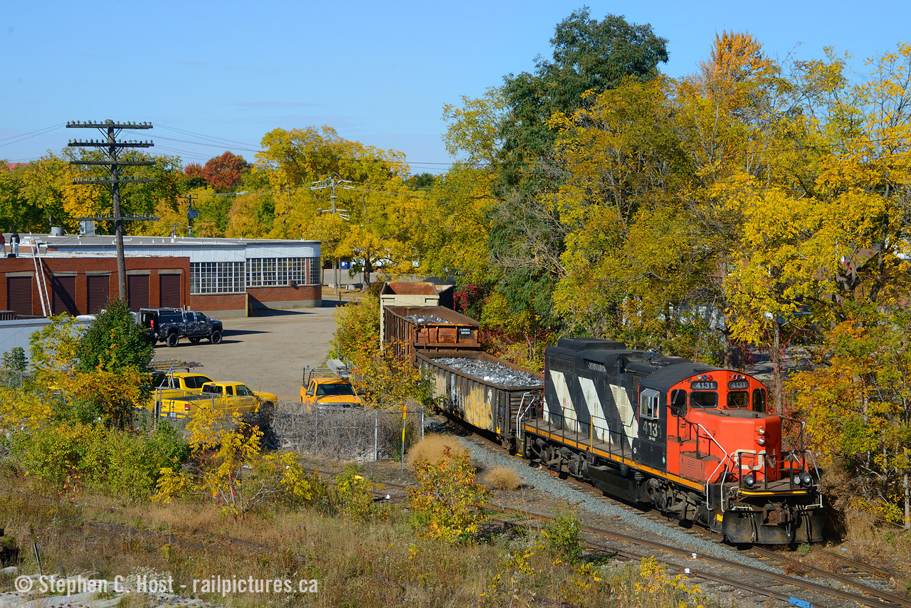 An extra 542 from Kitchener with just a single GP9's working Guelph on the east leg of the wye on a beautifully warm fall day. October 2022 was just a gorgeous month with great colour. In the background is Guelph Twine, a long time Guelph rail using customer (many decades) and still gets cars today.