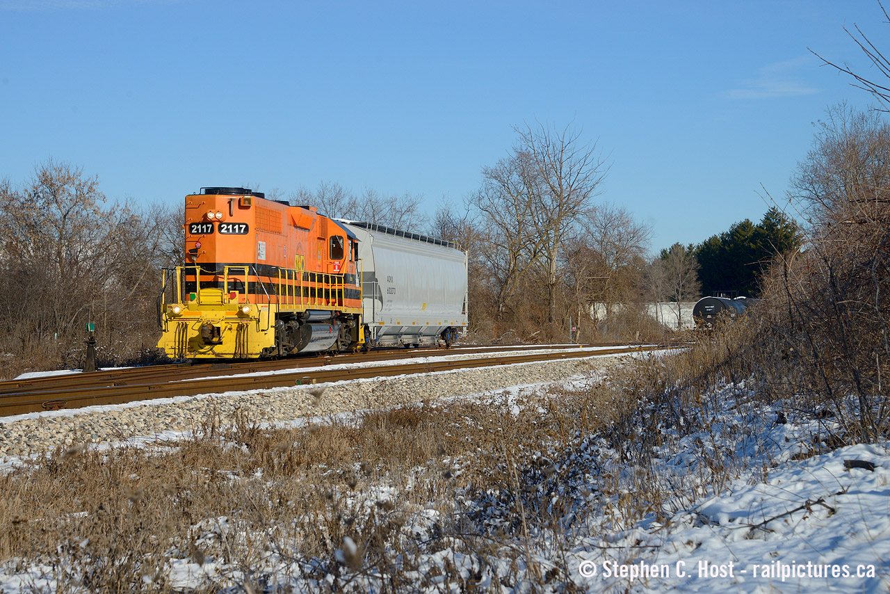 GEXR 583 switches lower yard in the early afternoon on a rare, for this winter and Ontario, sunny day. We've had about 4 sunny days in the last month or so... that's it. Also note the plastic hopper car being switched, it's brand new.