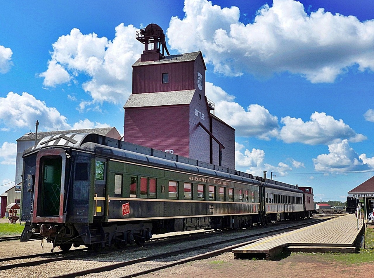 In the foreground is sleeper "Tracy" currently in use by Alberta Prairie Railway Excursions. This sleeper was built in 1931 by Canadian Car & Foundry and CPR as sleeper "Solsgirth", then renamed CPR sleeper "Tracy" in 1946. Sold to Alberta Prairie Railway Excursions in 1994.