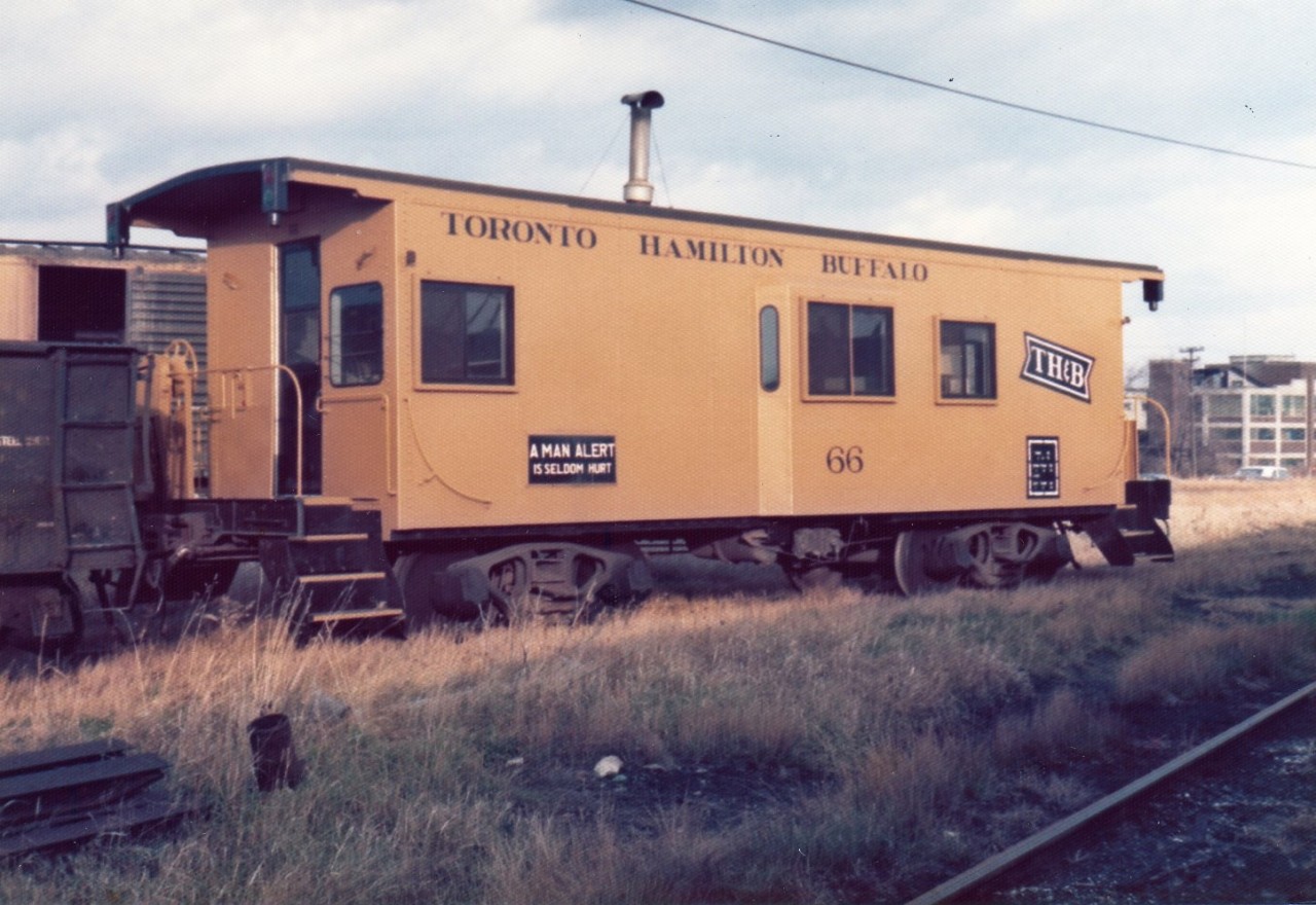 TH&B 66 sits in the Aberdeen Avenue yard on this sunny and warm late spring day.
Information gathered from http://www.thbrailway.ca/ suggests that TH&B 66 was built by American Car & Foundry in  Berwick, Pennsylvania in 1918. It was rebuilt into a bay-window style van in 1968. It was damaged by fire and sold to the Port Stanley Terminal Railway in Port Stanley, Ontario in 1983.