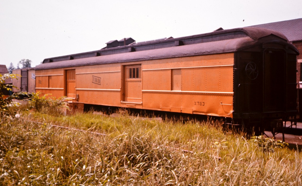 TH&B X 763 at Aberdeen Avenue yard in Hamilton, ON in early summer 1976 doesn't look so bad for 52 years old. Although that fresh coat of yellow paint certainly helps obscure some of life's blemishes. From information I've gathered (on the internet), this car was built by C.C.&F. in 1924 as baggage car 51. It was converted to MoW service and renumbered to X 763. It was retired from service in 1984 at 60 years old Having gone through at lot of my old photos since retiring 5 years ago, I look back now and wish I had splurged for another roll or two of film, and captured so much more of what was out there!