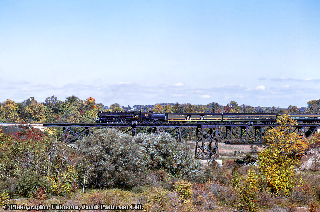 CNR 6167 makes its way west over East Catfish Creek at New Sarum nearing the halfway point of its excursion at St. Thomas.Originating at Toronto Union Station, the excursion ran to Hamilton where a pair of MLW RS3s; 3004, 3019, were added ahead of 6167 to assist the train up the Hagersville Subdivision to Caledonia, even though the 800 ton consist came in well under the 1,400 ton haulage capacity for Northerns up the grade. The diesels would be removed at Caledonia, the tender replenished with water, and the excursion would depart for Jarvis with a couple of runpasts along the way at Caledonia and Garnet, captured here by Bob Sandusky.  Further runpasts would be held along the Cayuga west of Jarvis before arriving at St. Thomas  where Doug Page captured the train  before it turned for home.Westbound approaching the Humber River at Toronto, John Freyseng Photo.Original Photographer Unknown, Jacob Patterson Collection Slide.