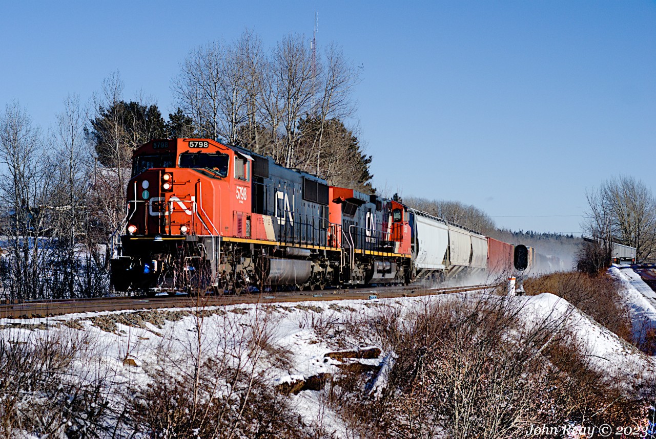 February 1st at 2:32 p.m., CN L507 by Oxford Junction, decent sized train. CN SD75I 5798, CN DASH 9-44CW 2666 with 268 axles.  This train runs daily from Dartmouth NS to Moncton NS, often stopping to lift traffic from the CBNS railway yard in Truro NS. The tri-level auto carriers originate at Autoport in Dartmouth and most of the mixed freight behind the locomotives came from Truro. See video at https://www.youtube.com/watch?v=TWLegxhm-bQ