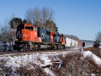 February 1st at 2:32 p.m., CN L507 by Oxford Junction, decent sized train. CN SD75I 5798, CN DASH 9-44CW 2666 with 268 axles.  This train runs daily from Dartmouth NS to Moncton NS, often stopping to lift traffic from the CBNS railway yard in Truro NS. The tri-level auto carriers originate at Autoport in Dartmouth and most of the mixed freight behind the locomotives came from Truro. See video at https://www.youtube.com/watch?v=TWLegxhm-bQ