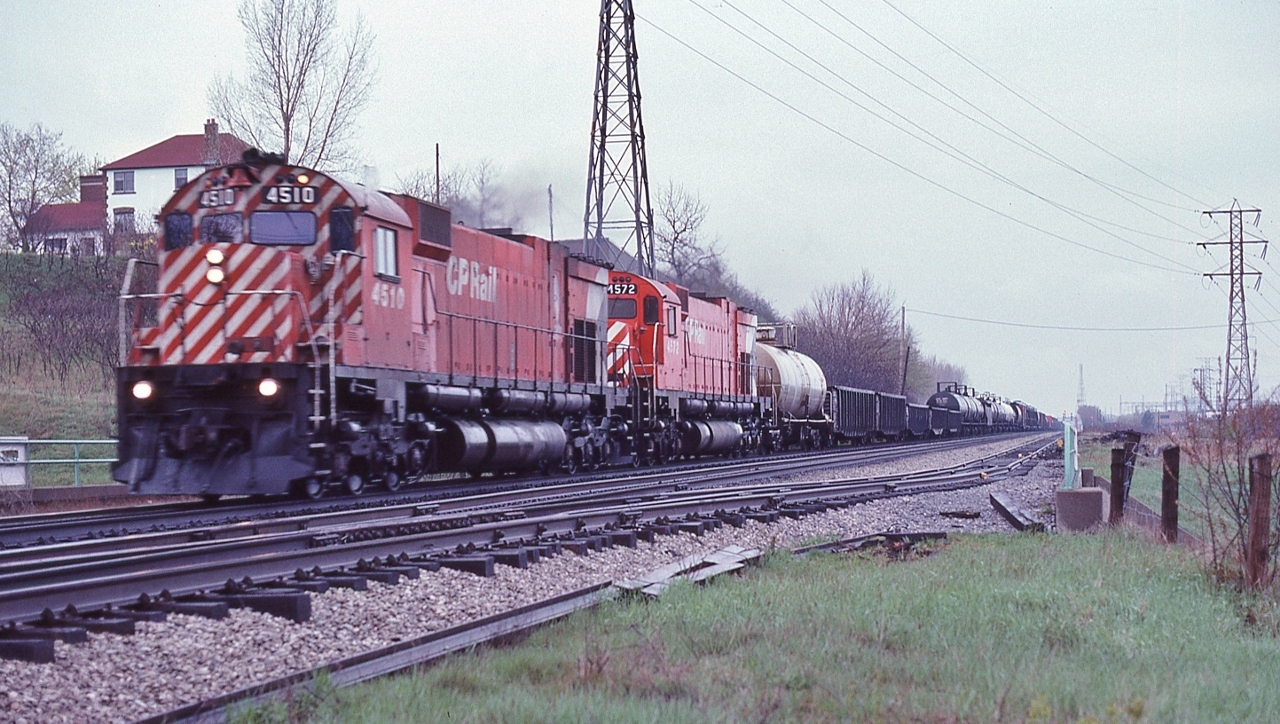The eastward view at the west end of the CP Rail Leaside yard, 


  A pair of MLW's best....M-630 's, built 1969 & 1970, retired 1994 & 1995, CP Rail 4510 – 4572 power a mixed freight (note the tank car marshalled next the power) down grade toward the Mount Pleasant crossovers and onward to the  West Toronto diamonds / Lambton.


 Above the Bayview Ave underpass, CP Rail Extra 4510 West (white markers and white flags) near mile post 1.0 CP Rail North Toronto Subdivision, May 6, 1979 Kodachrome by S.Danko


  Noteworthy: the distant signals mile 206 Belleville Subdivision for the Leaside crossover (one way eastbound south track to north track) and at distance right is the triple absolute target signals from the Belleville Subdivision Don branch to access the south track Belleville Sub eastbound.  


 More Leaside


       restaurant 1978   


       Budds 4 U   


sdfourty