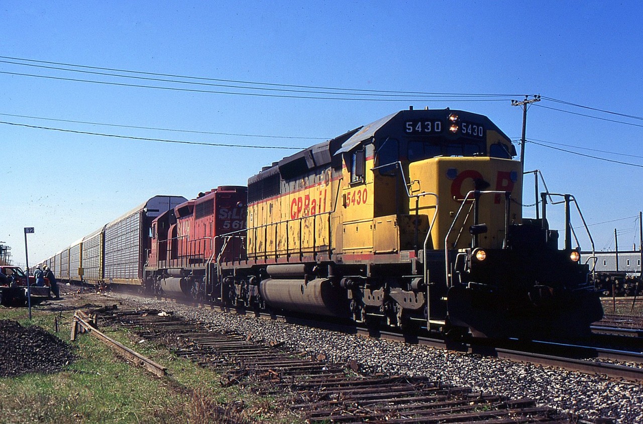 NS 287 with CP SD40-2 5430 and STL&H SD40-2 5615 passing through Mile 12 on the CN Grimsby Sub in 1998.