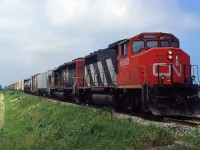 CN 449 with CN GP40-2(W) 9560 and CN SD40-3 6014 passing through Mile 12.84 on the CN Grimsby Sub in 1998.