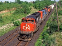 CN 334 with CN 5299 West approaching Jordan at Mile 15 on the south track of the CN Grimsby Sub in 1999.