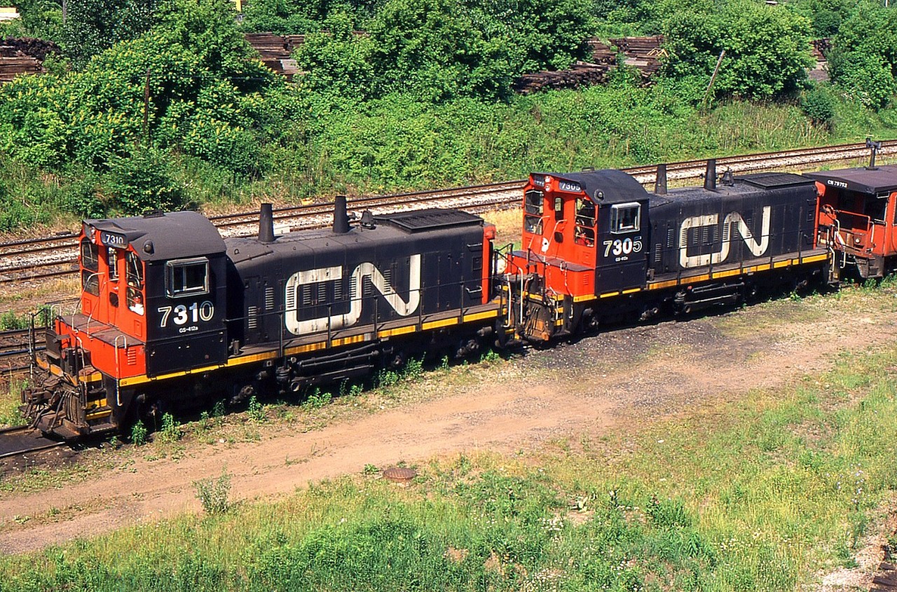 A pair of CN SW1200RS 7310 and 7305 at Niagara Falls Yard back in 1999.