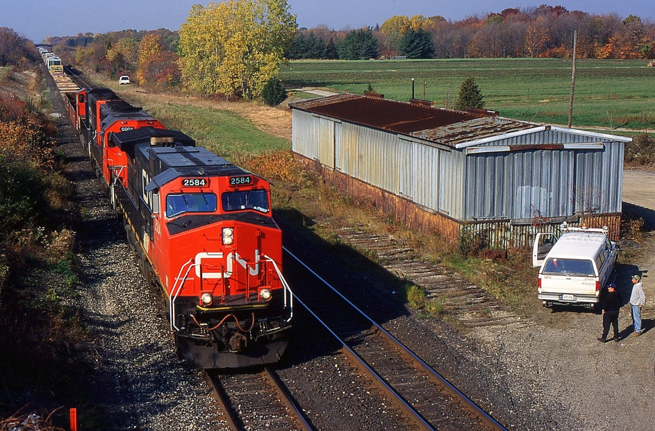 CN 339 with CN 2584 East approaching St. Catharines on the south track at Mile 15 of the CN Grimsby Sub, the freight shed and siding are now gone.