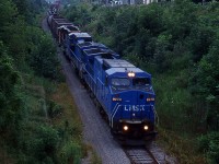 CN 334 was detoured onto the Canal Sub and Thorold Sub to bypass the CN Stamford Sub at slow speed coming down the Thorold Sub, this was rare back in 2000.
Unfortanly came through just when the sun was setting.