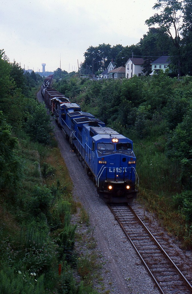 CN 334 was detoured onto the Canal Sub and Thorold Sub to bypass the CN Stamford Sub at slow speed coming down the Thorold Sub, this was rare back in 2000. 

Unfortanly came through just when the sun was setting.