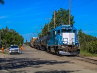 Over the summer, I had been itching to shoot the SRC movements on the scenic ex-CN Avonlea Subdivision, even if modern activity was a shell of the former power variety once seen on the trackage. I had initially camped out on the southeastern side of the valley in the hopes of capturing a scenic view of the CN Moose Jaw bridge but I drew an unlucky light power card so I got around to the street running portion of their transfer with CP. It apparently took me a while as I had just been pulling into Home Street when I could see 2238 rising upgrade around the corner, making me scramble to get my wide-angle lens out in time. To the left, a crew in a work truck escorted the local towards the junction with the Avonlea, and manually protected each roadway the tracks intersected with. Prior to their departure towards Truax, I had a fun chat with both crews and would, unfortunately, have to decline the temptation of a chase as I had to be back in Regina for a shift at my summer job.