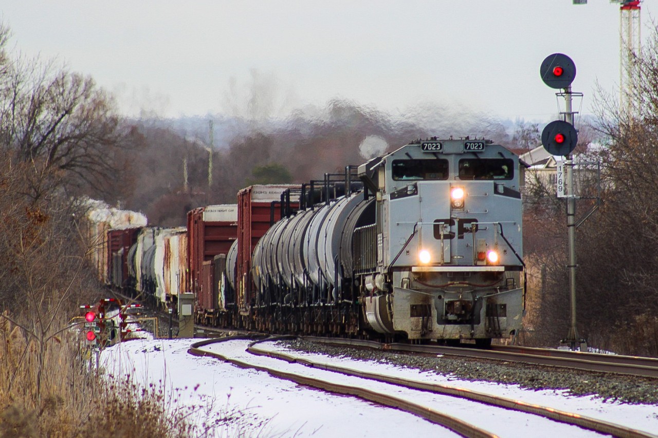 CP 2-230 clears Oshawa West moments after the crew finished dealing with a locked axle. I believe it was the 14th that began to smoke after departing Toronto Yard and set off the defect detector near Cherrywood, so they pulled into the siding at Whitby to take off the breaks on that axle before continuing business as usual. They managed to pick up some speed by the time they rounded the corner behind me with the assistance of UP 7975 which seemed to stalk 7023 around Canada for a couple weeks following this, as the pair were then rallied back and forth by Montreal and Edmonton on 118 and 119.