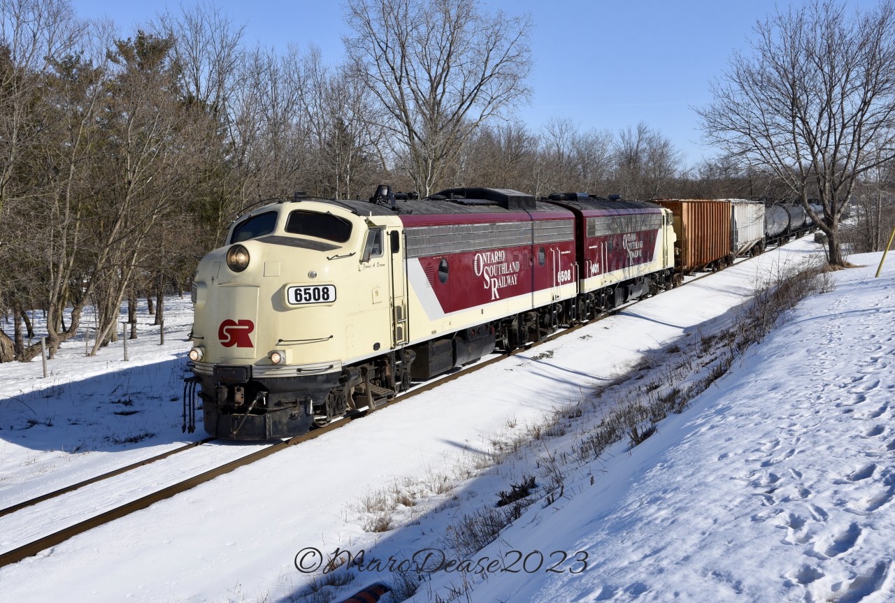 A rare appearance by OSR's matching pair of F9's as they depart Ingersoll, ON., for Putnam and then onto St. Thomas on a beautiful sunny winter's day.